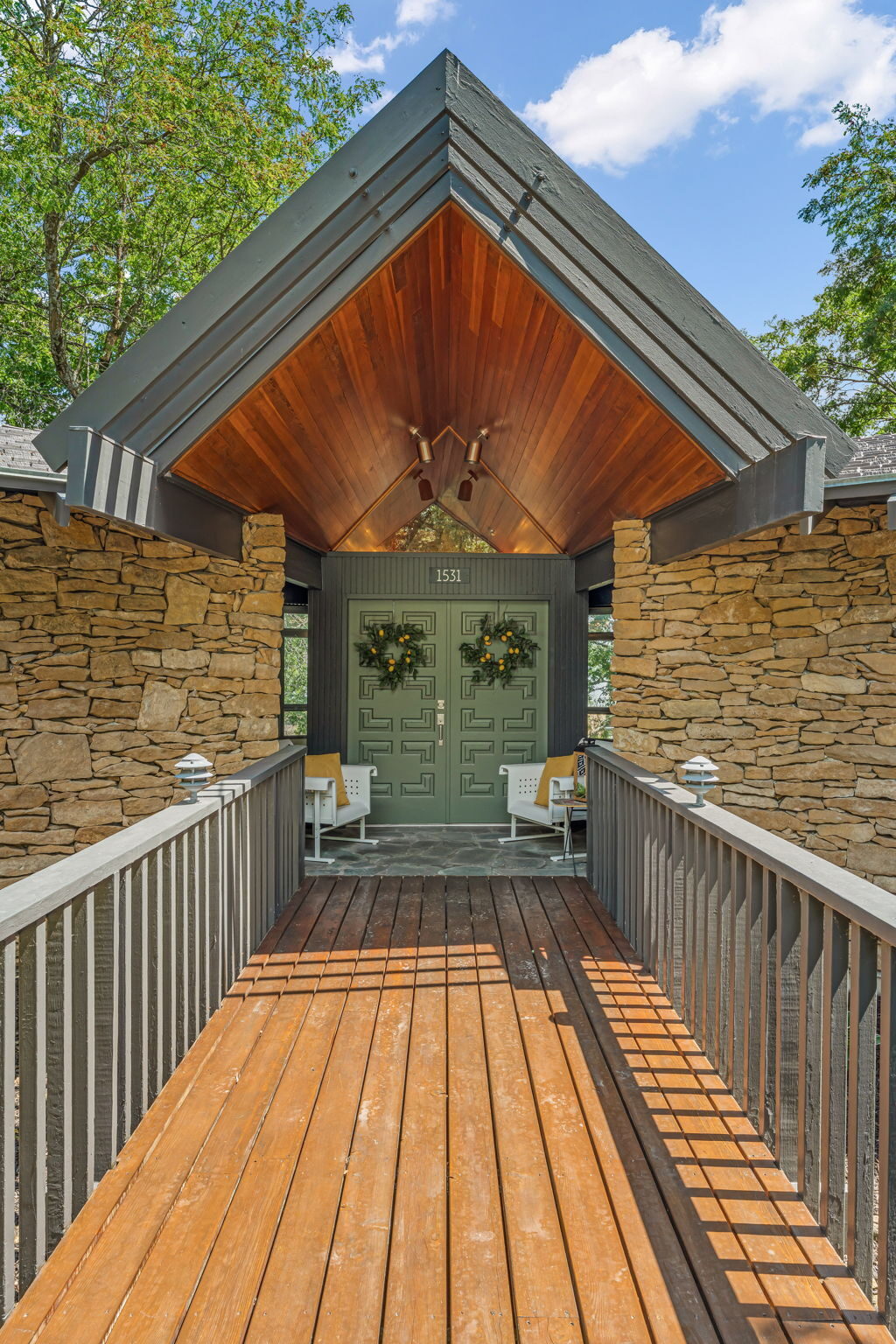 Covered entry bridge leading to the front doors