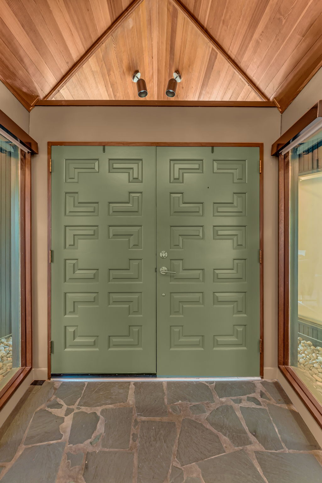 Detail of the original green geometric front doors at 1531 Crescent Road