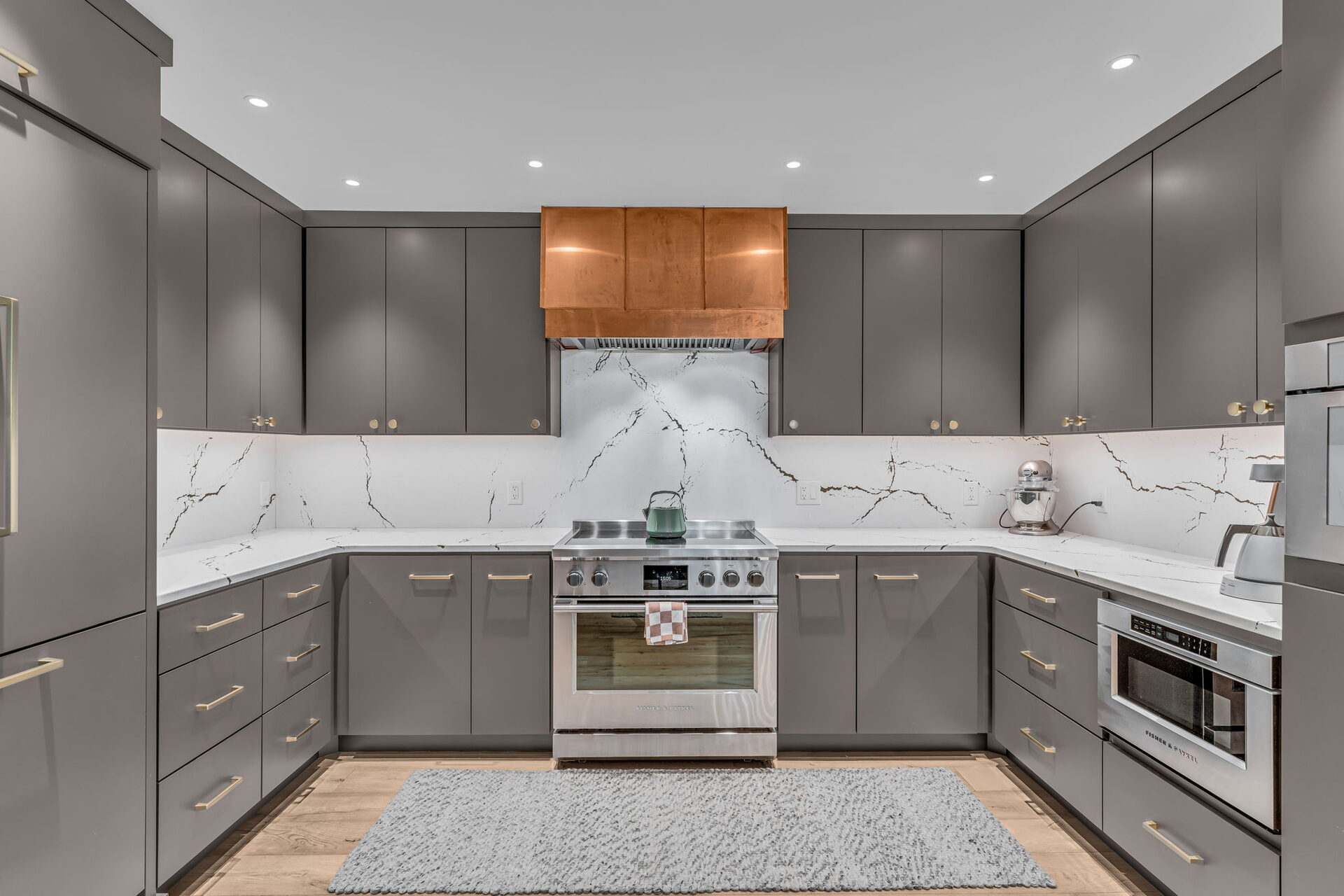 Kitchen range wall with copper hood