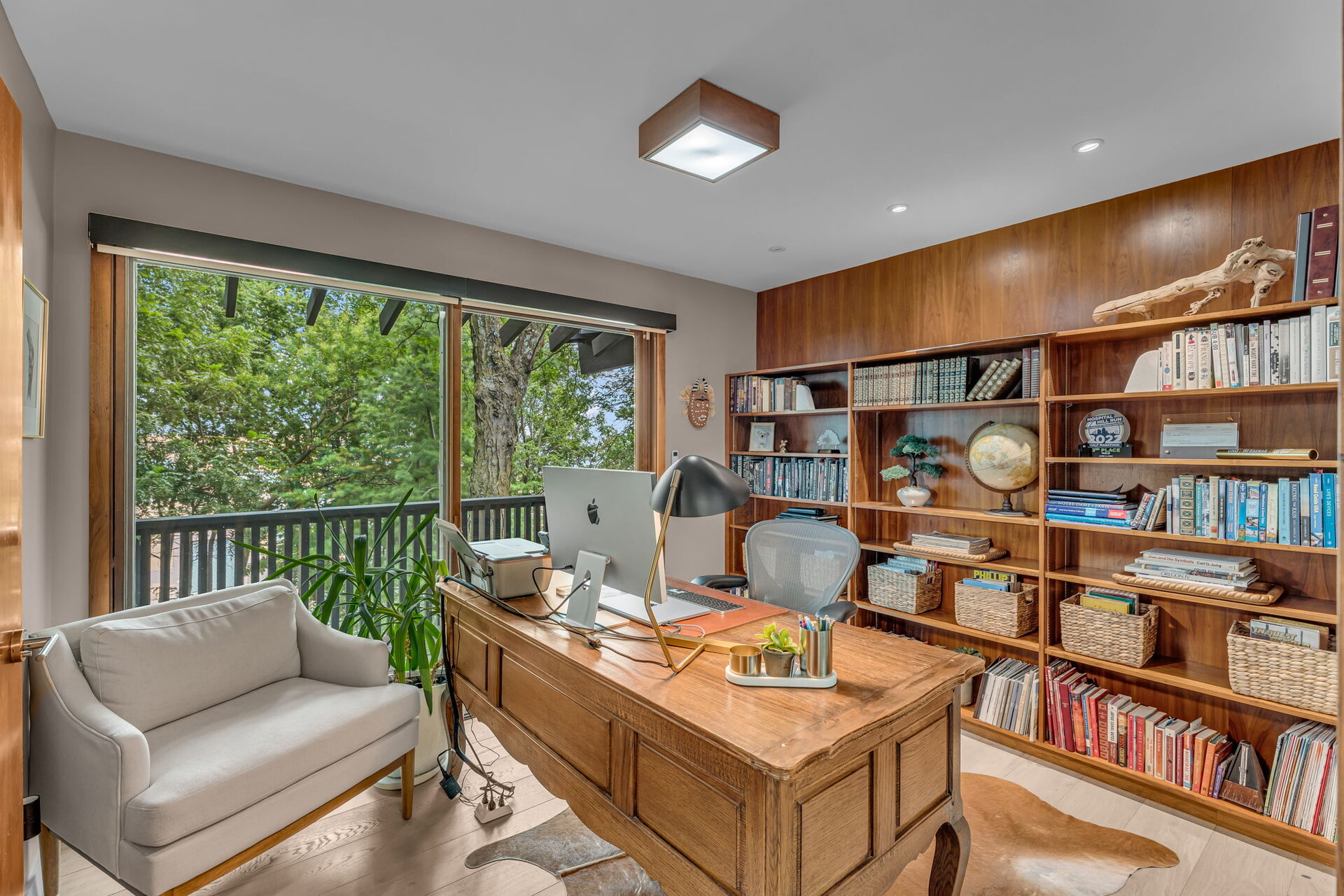 Office and study with built-in wood shelving
